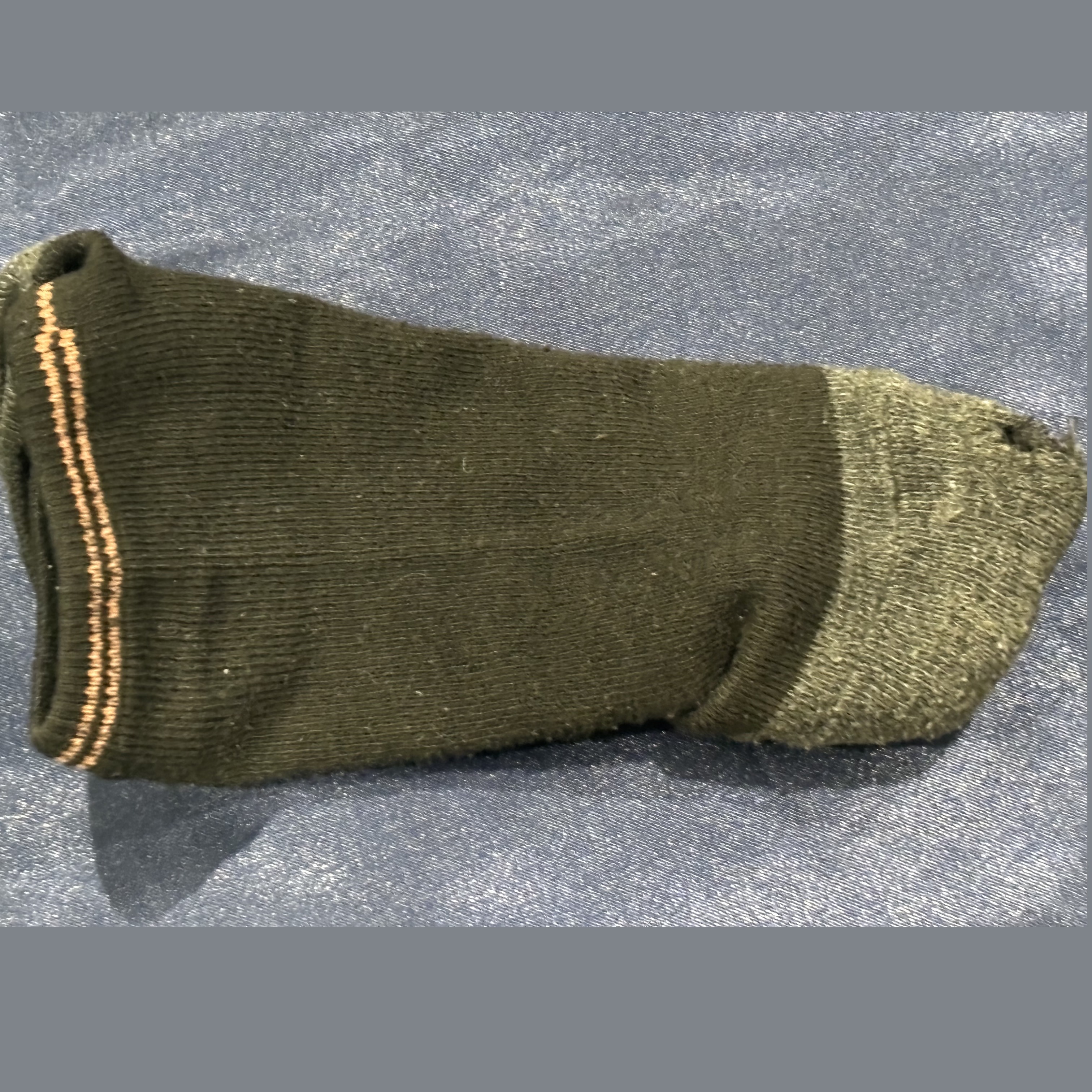 Single worn sock with hole